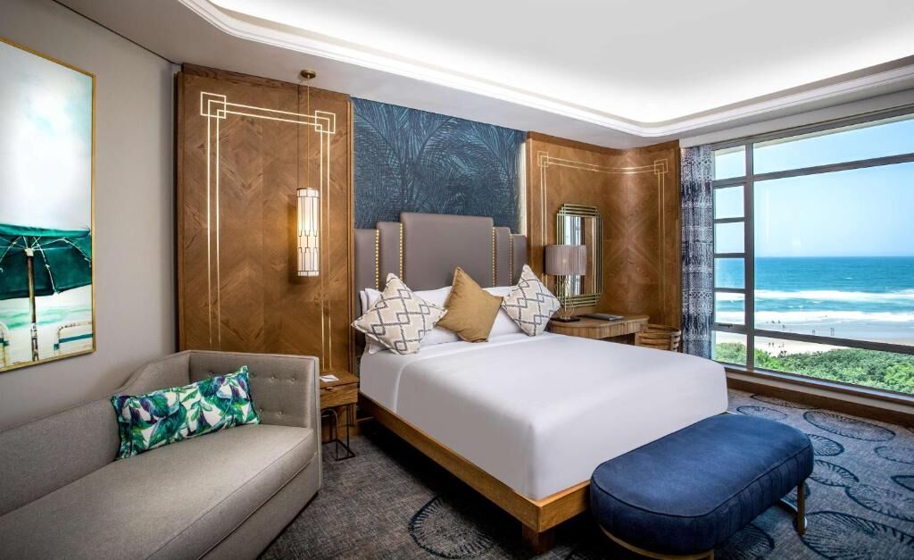 Sea-facing room with king bed at Suncoast Hotel & Towers